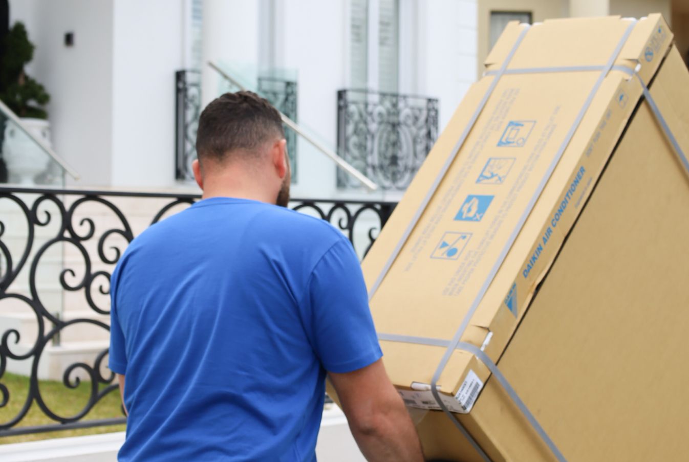 Teknicool technician delivering a residential air conditioner in Sydney