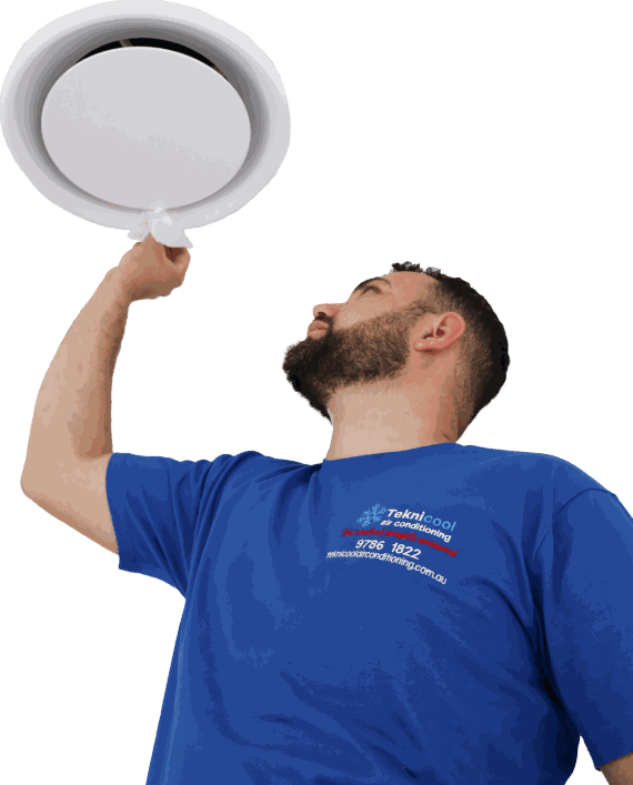 Licensed Teknicool technician commissioning an air conditioner